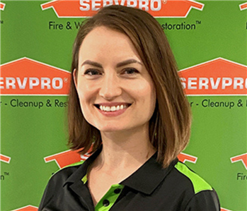 woman in front of backdrop