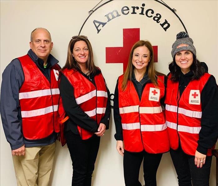 Servpro team members with red cross jackets